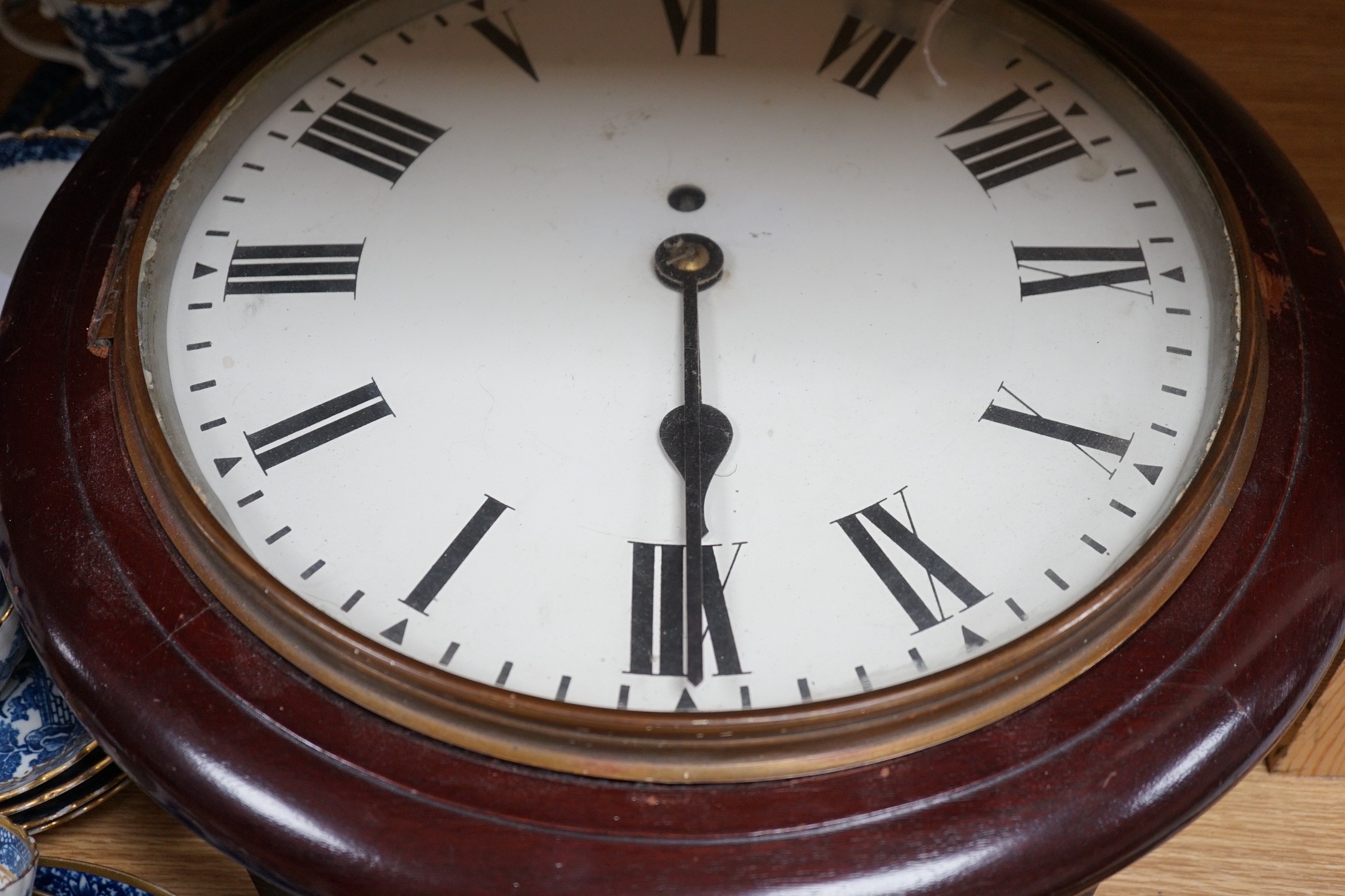 An early 20th century mahogany circular wall clock, single fusee movement, 41cms wide